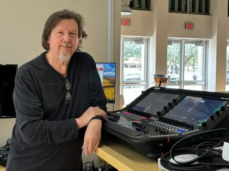 Curt Taipale Standing Next to a Console